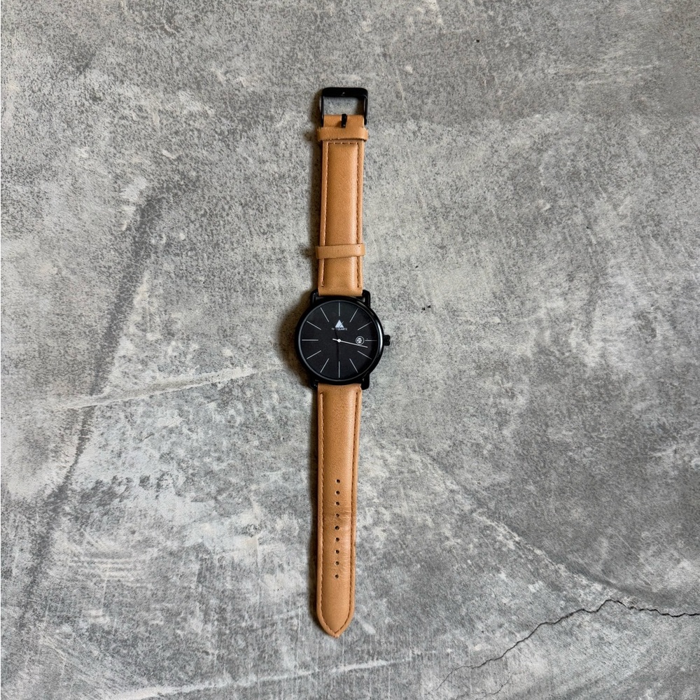 Light brown leather watch with black accents